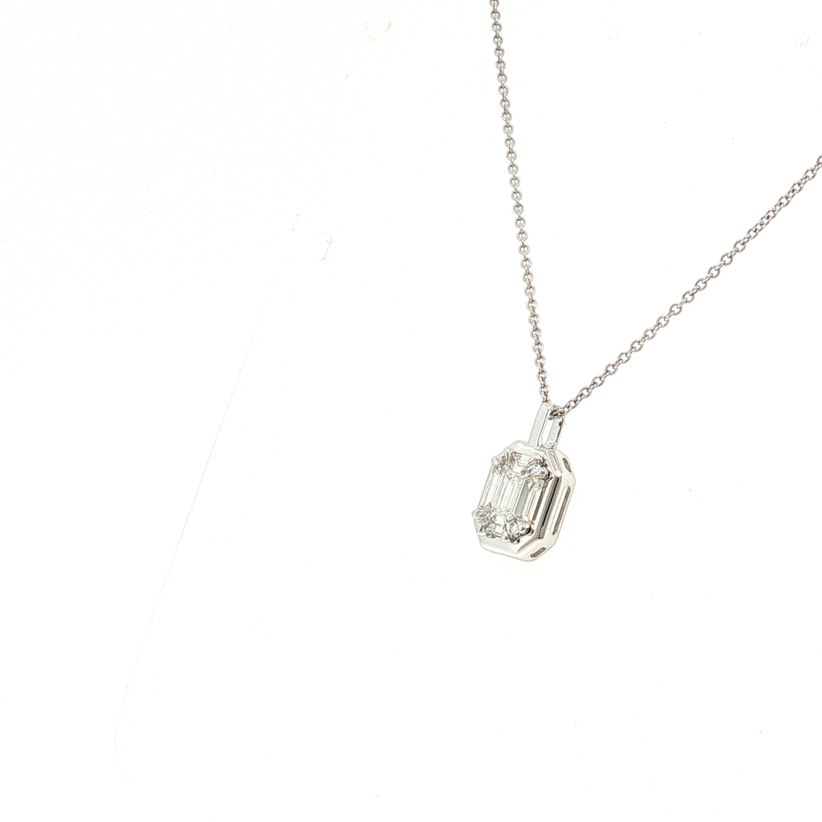 Allie natural emerald and tapered baguette diamond illusion pendant