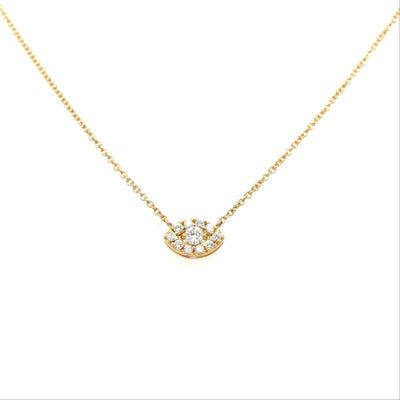 Gold necklace with a small, round, diamond-studded pendant on a white background