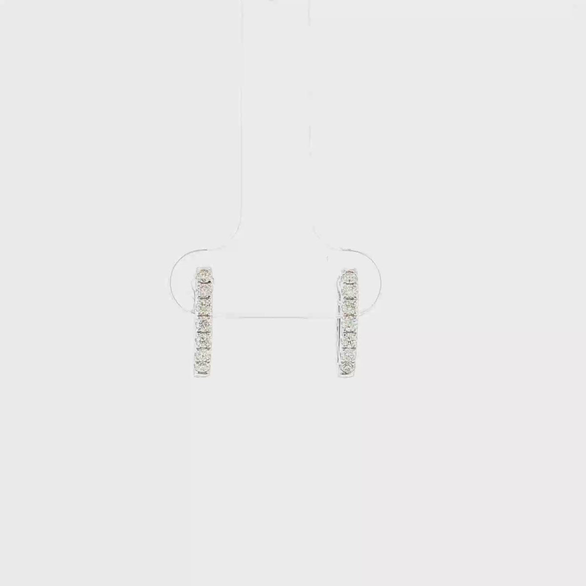 Video of Maddie 18k white gold natural diamond huggie earrings