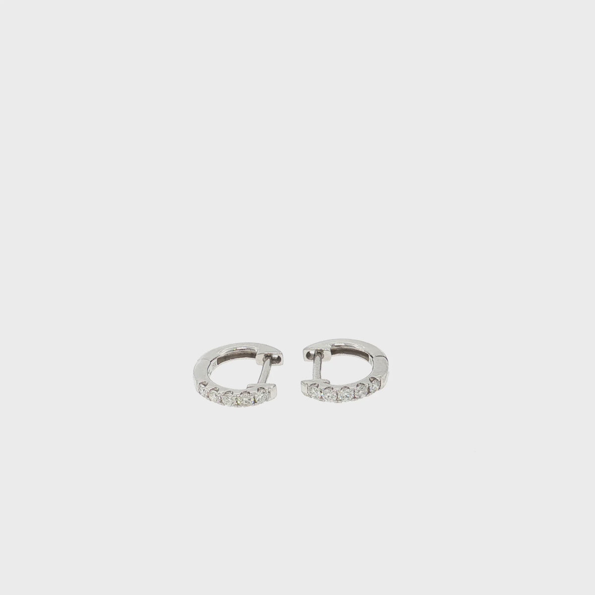 Sophie petite natural diamond huggie earrings in 18k white gold – product video